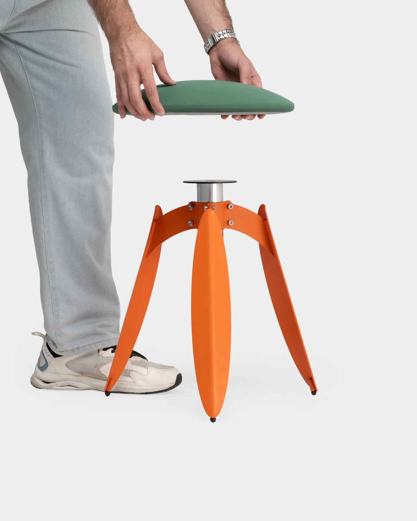 Lowering the leather seat onto the orange Dot base