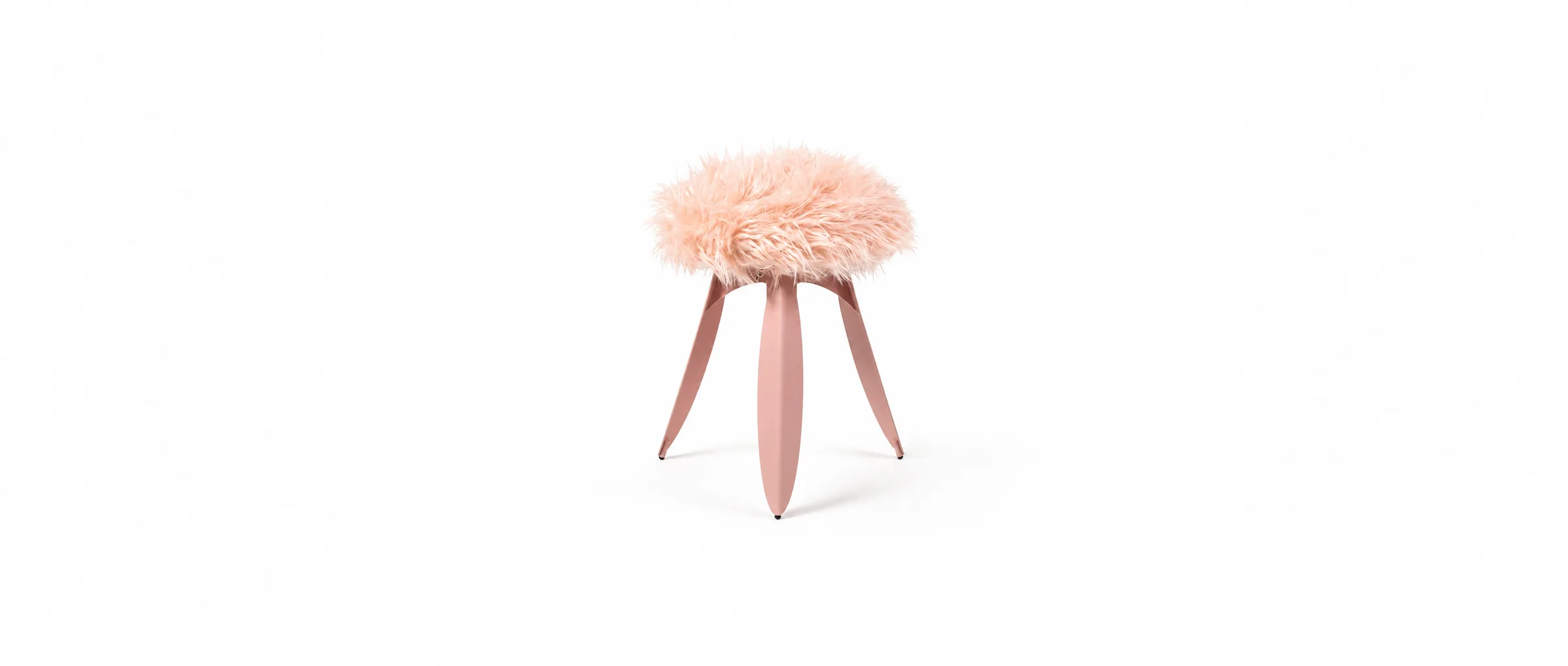 The fur-topped Dot stool on its leaf-bent legs against white