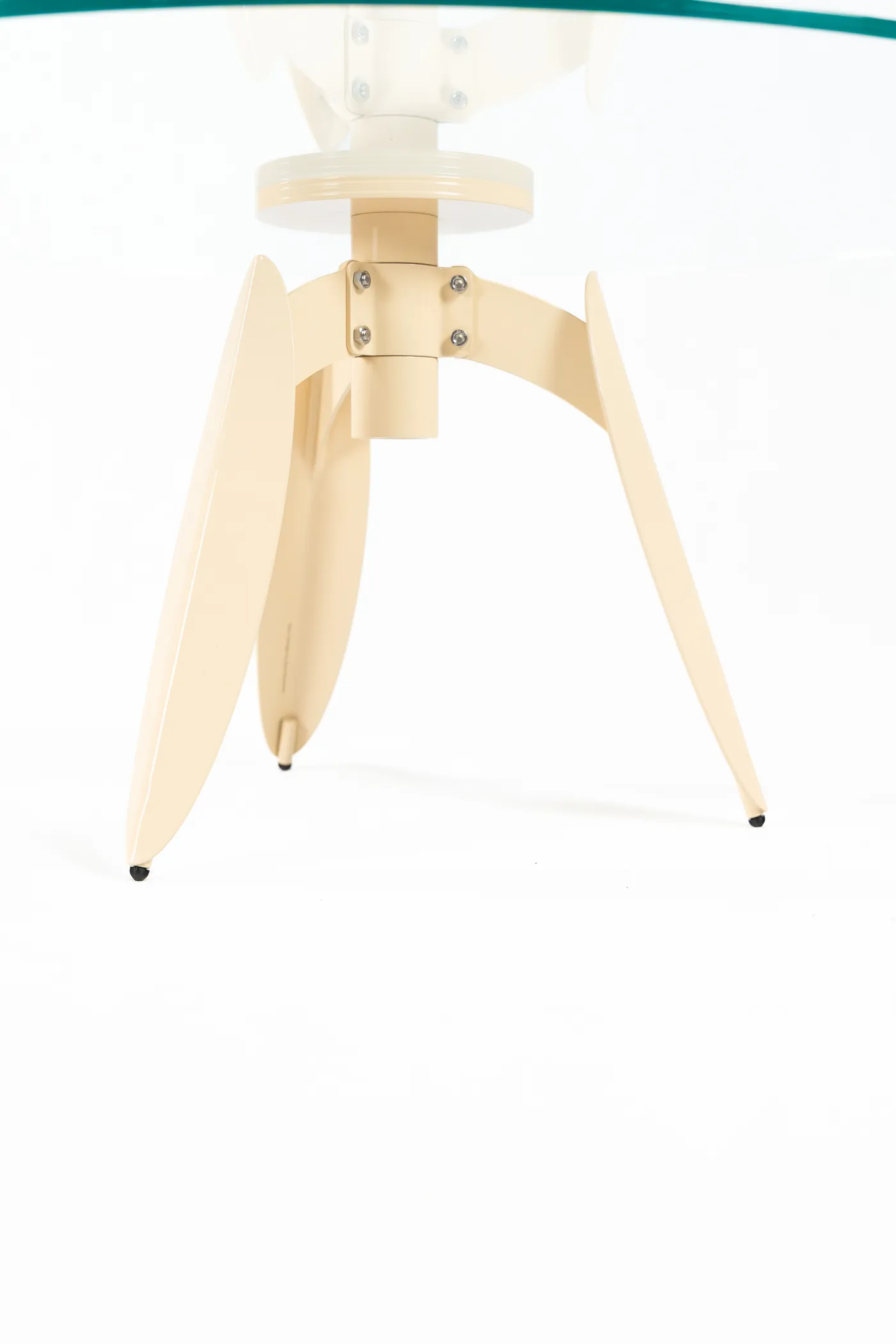Detail of the Dot table's folded leg beneath the glass
