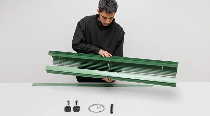 The assembled body lifted from the bench, its fittings laid out below