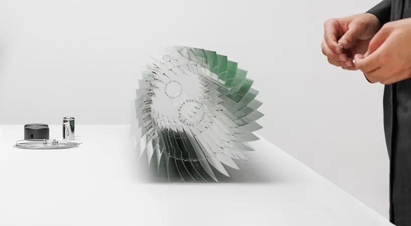 The blades fanned open around the acrylic frame
