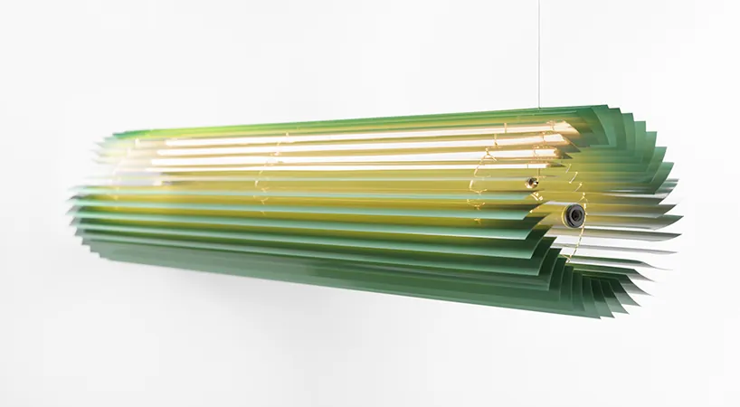 The finished linear pendant hanging, lit from within