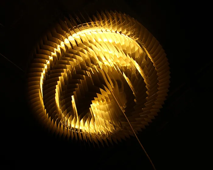 Keker head-on, its blades spiralling around the light